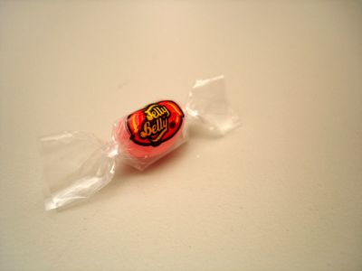 one single, wrapped JellyBelly jelly bean.